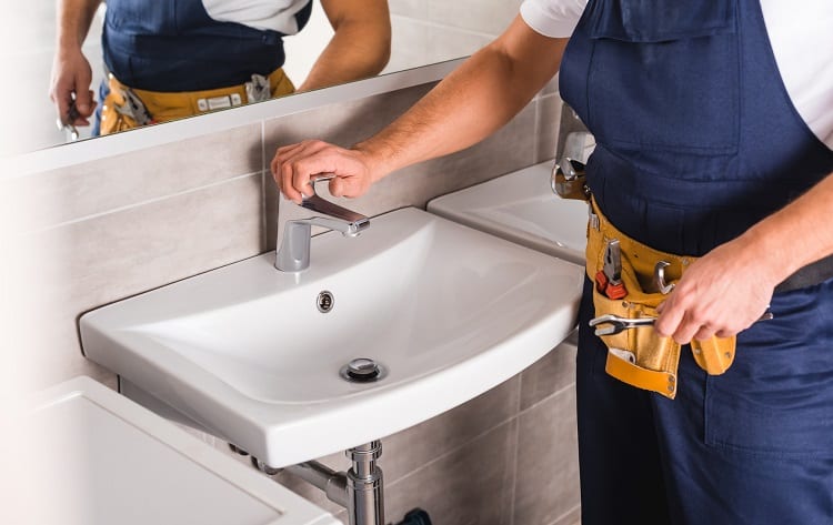 Plumber Testing Pipe