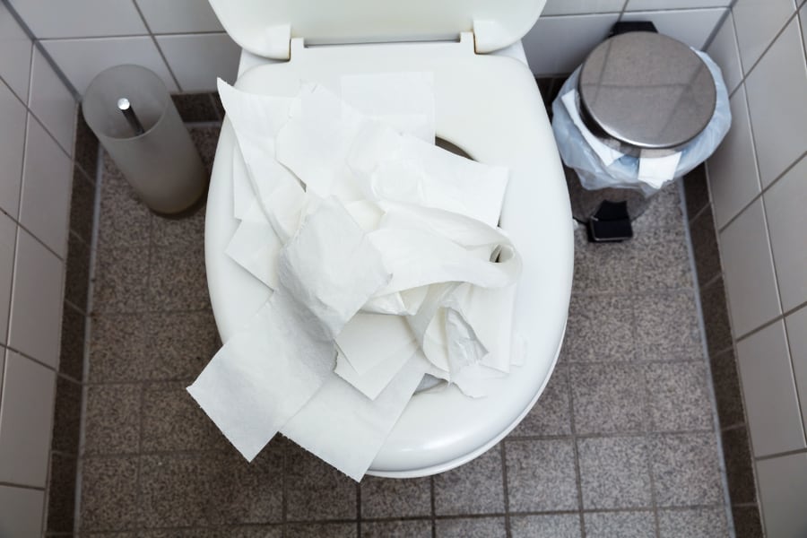 clogged toilet with paper