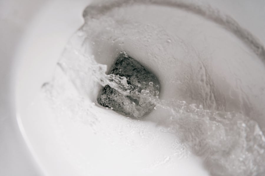 flushing water in toilet
