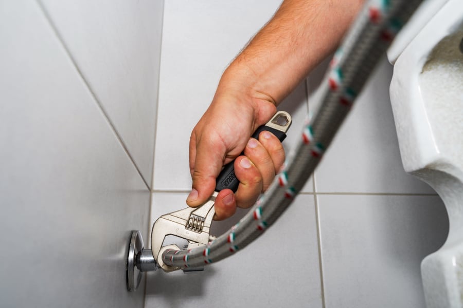 plumber fixing toilet